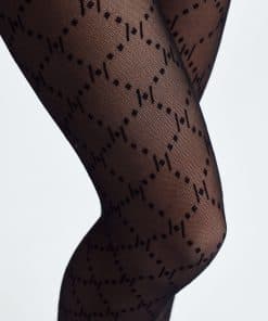Close-up of black sheer tights with a geometric dotted diamond pattern on the legs.