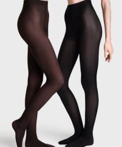 Two models wear opaque full-length tights in brown and black, standing with legs crossed.
